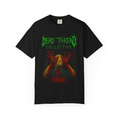 Black t-shirt featuring a surreal horror graphic of a yellow-skinned creature with red elongated hands covering its eyes, set against a chaotic red and black background. Above the illustration, jagged green text reads "DEAD THREAD COLLECTIVE." The design evokes gothic, punk, and horror aesthetics.