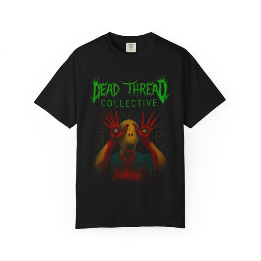 Black t-shirt featuring a surreal horror graphic of a yellow-skinned creature with red elongated hands covering its eyes, set against a chaotic red and black background. Above the illustration, jagged green text reads "DEAD THREAD COLLECTIVE." The design evokes gothic, punk, and horror aesthetics.