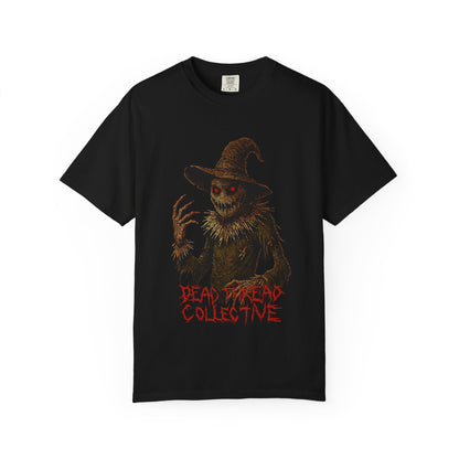 Black t-shirt featuring a terrifying scarecrow with glowing red eyes, jagged claws, and a twisted grin, wearing a tattered hat and outfit; beneath the figure, the words "DEAD DREAD COLLECTIVE" appear in jagged red font, evoking a gothic horror vibe.